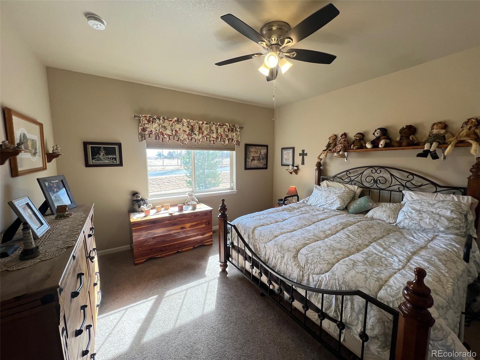 2029 South Flanders Way, Unit B Aurora, CO 80013 - Photo 22 of 42 a bedroom with a bed and a window