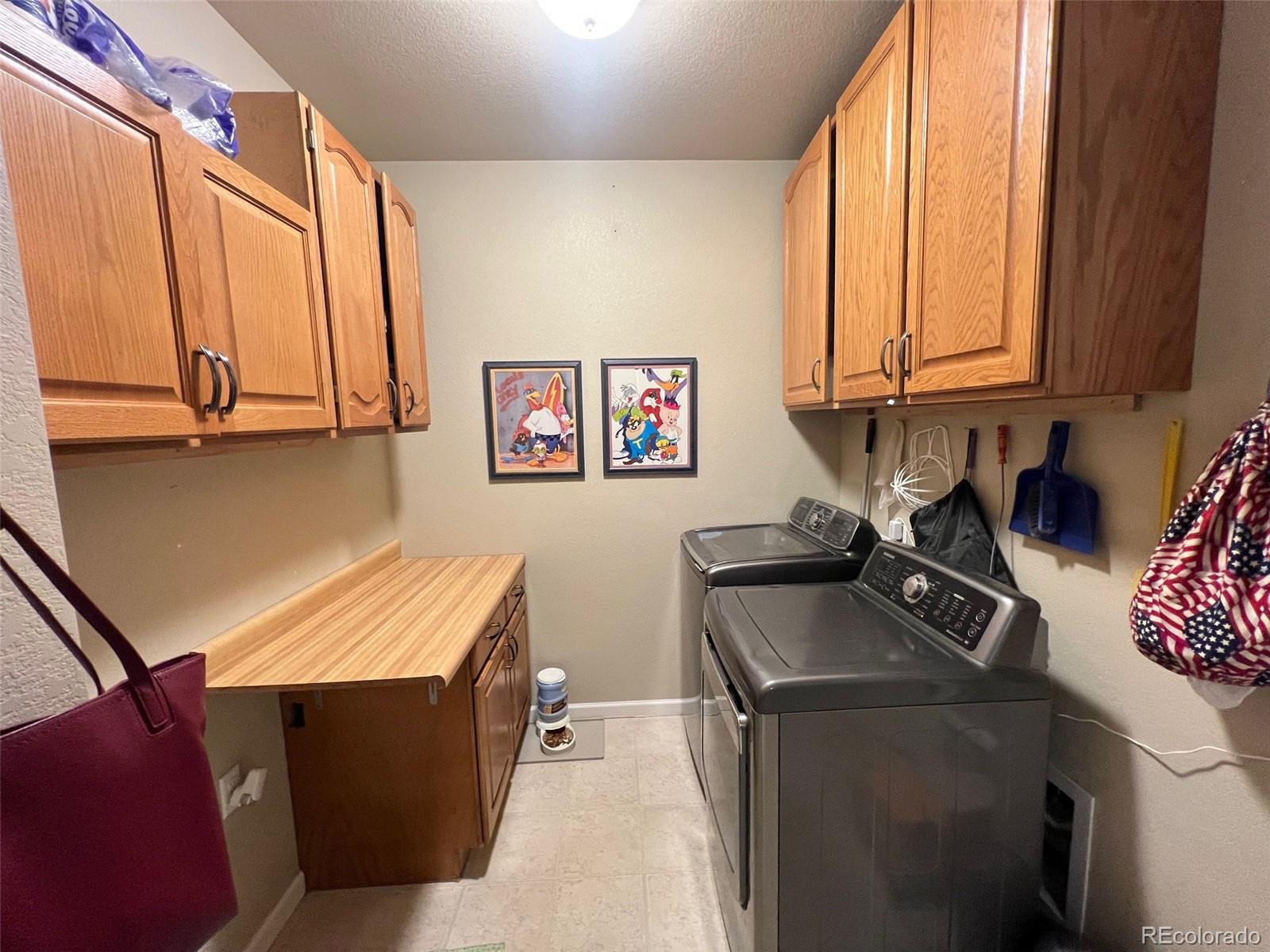 2029 South Flanders Way, Unit B Aurora, CO 80013 - Photo 31 of 42 a kitchen with stainless steel appliances a sink a stove and a refrigerator
