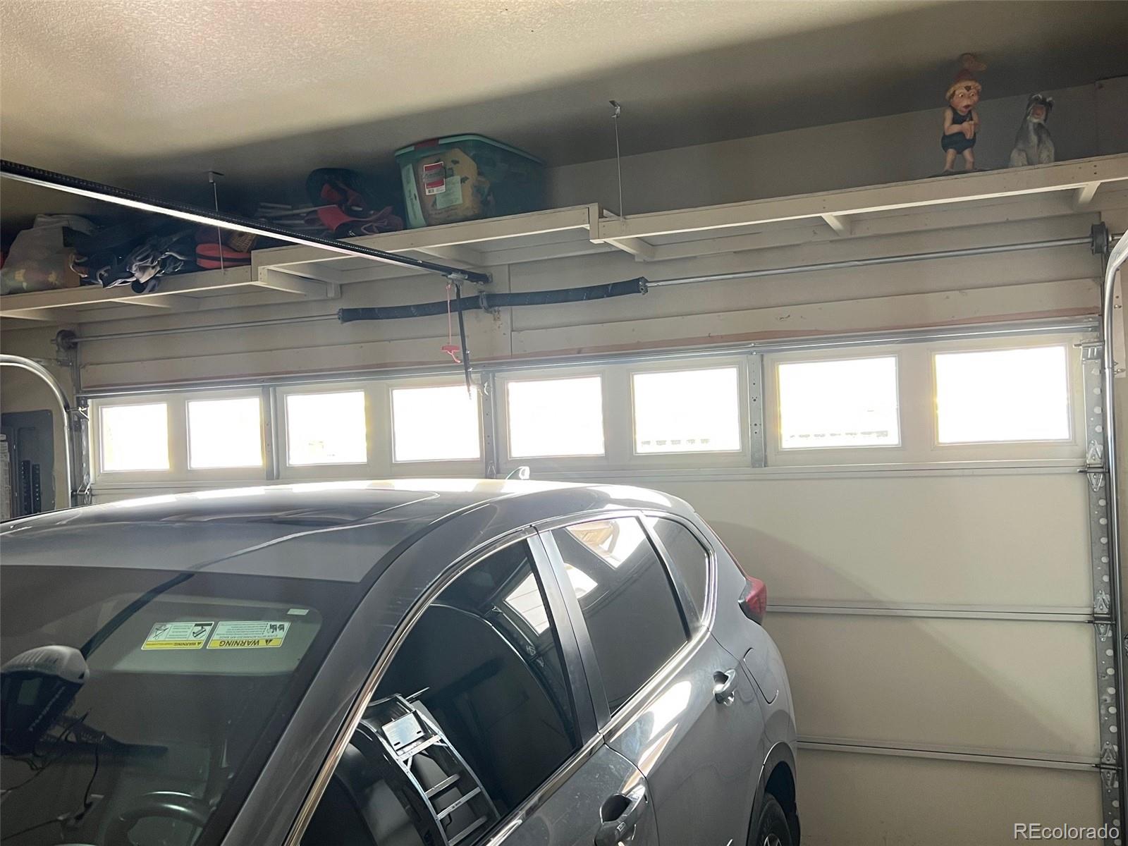 2029 South Flanders Way, Unit B Aurora, CO 80013 - Photo 32 of 42 a view of car in garage