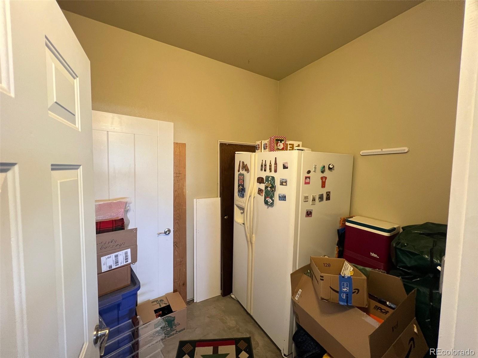 2029 South Flanders Way, Unit B Aurora, CO 80013 - Photo 33 of 42 a living room with furniture and a window