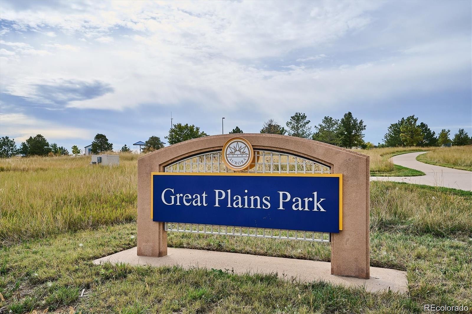 2029 South Flanders Way, Unit B Aurora, CO 80013 - Photo 34 of 42 a sign on the side of the road