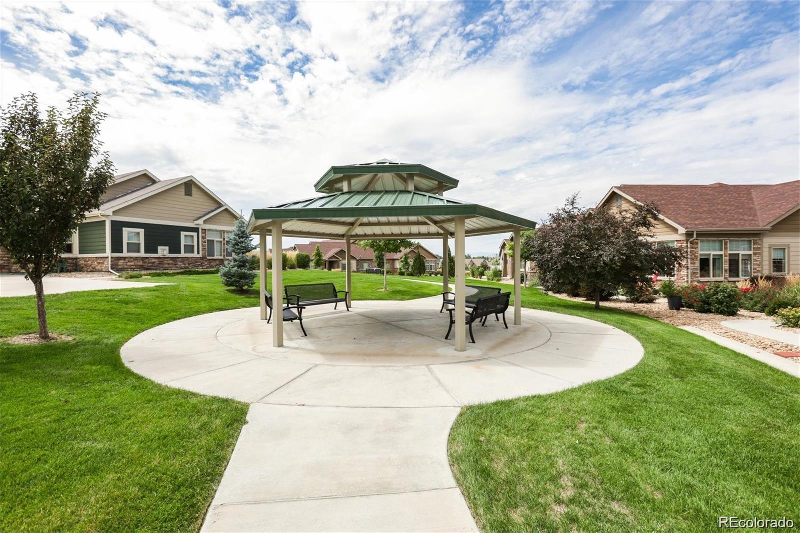 2029 South Flanders Way, Unit B Aurora, CO 80013 - Photo 37 of 42 a view of outdoor space yard deck patio and swimming pool