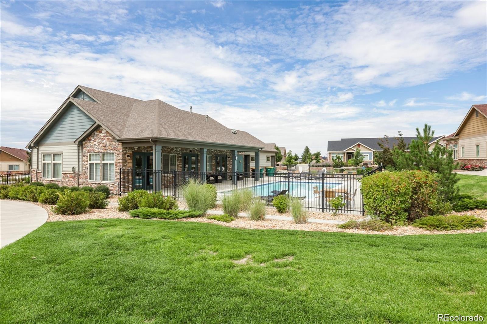 2029 South Flanders Way, Unit B Aurora, CO 80013 - Photo 39 of 42 a front view of house with yard and green space