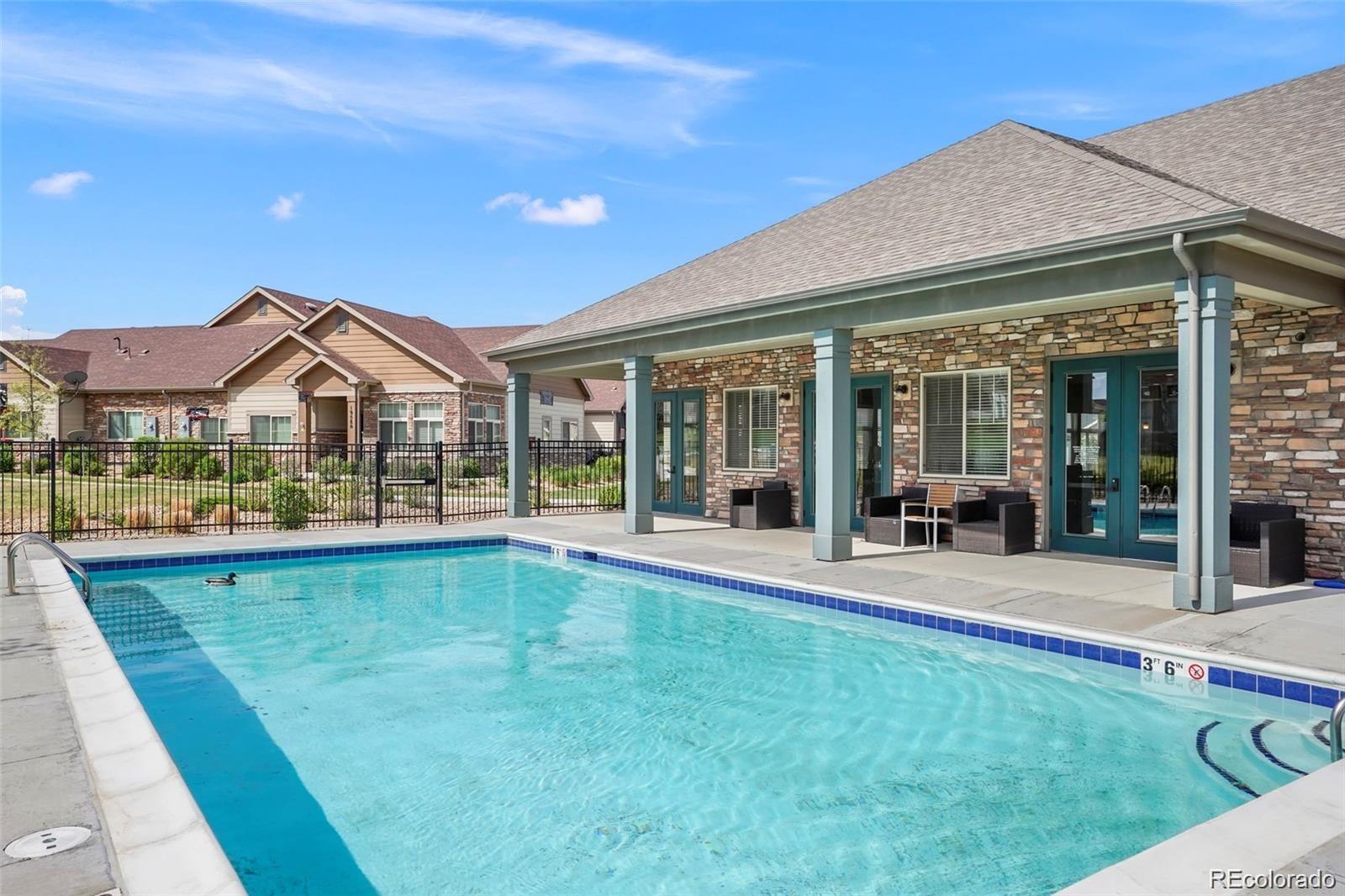 2029 South Flanders Way, Unit B Aurora, CO 80013 - Photo 40 of 42 a view of house with outdoor space and swimming pool