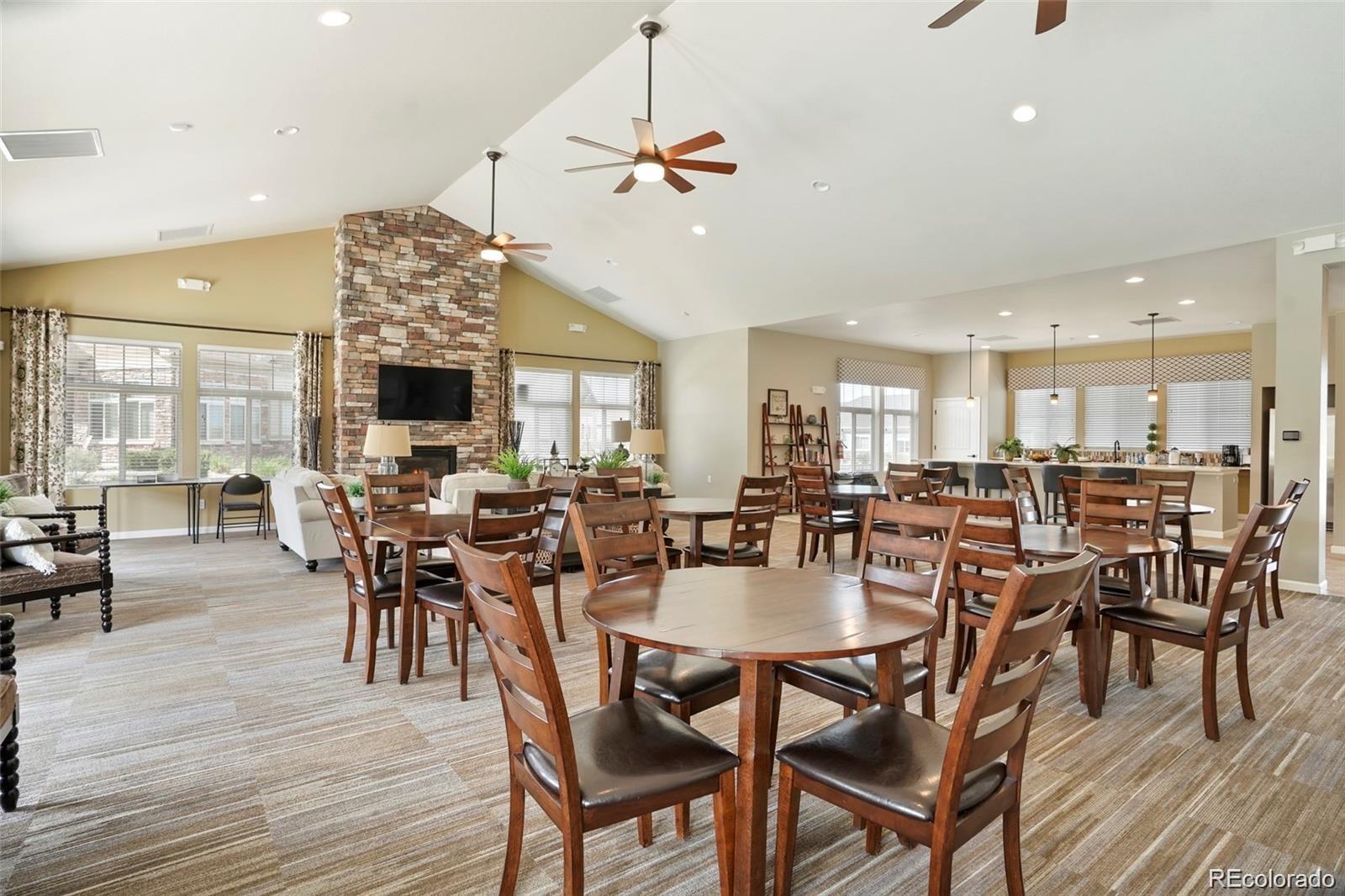 2029 South Flanders Way, Unit B Aurora, CO 80013 - Photo 41 of 42 a view of a dining area with furniture and wooden floor