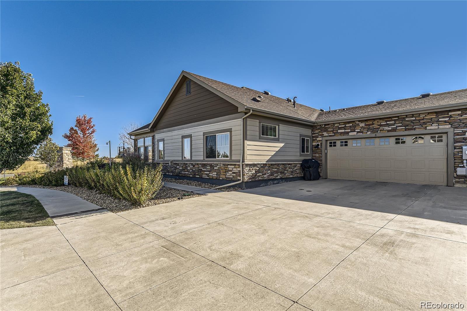 2029 South Flanders Way, Unit B Aurora, CO 80013 - Photo 6 of 42 a view of house with outdoor space and porch