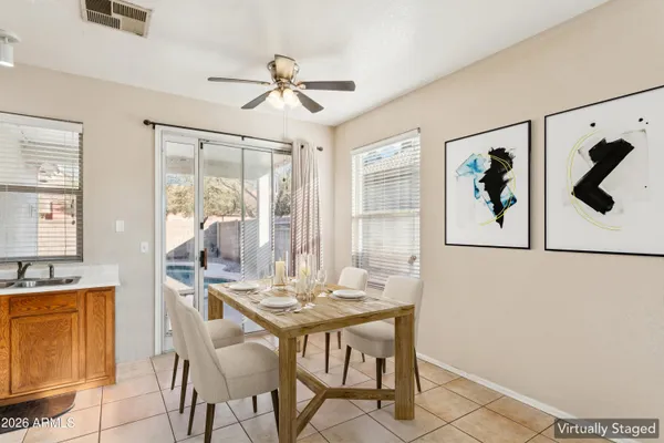 a dining room with furniture and window