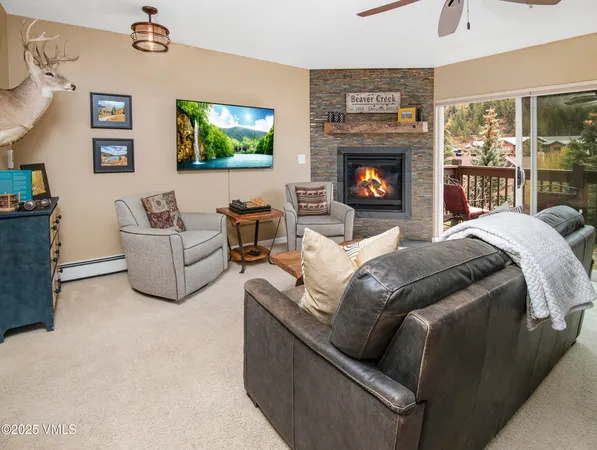 a bedroom with furniture and a fireplace
