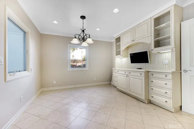 a view of a livingroom with furniture and chandelier