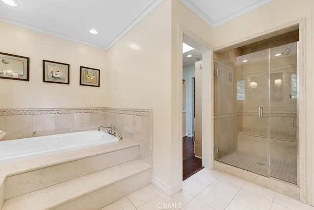 a spacious bathroom with a bathtub and shower