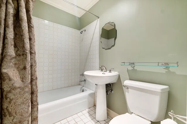 a bathroom with a sink a toilet and bathtub