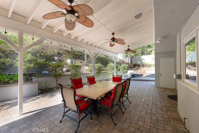 a view of a dining room with furniture wooden floor and chandelier