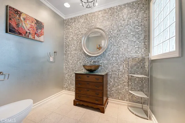 a bathroom with a toilet a sink and a shower