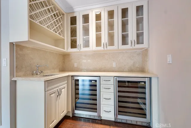 a view of kitchen with granite countertop a stove and a sink