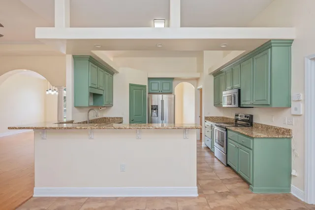 a large bathroom with a sink and a mirror