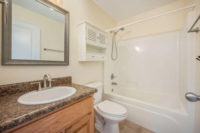 a bathroom with a sink a toilet and a bathtub