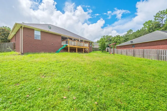a backyard of a house with lots of green space