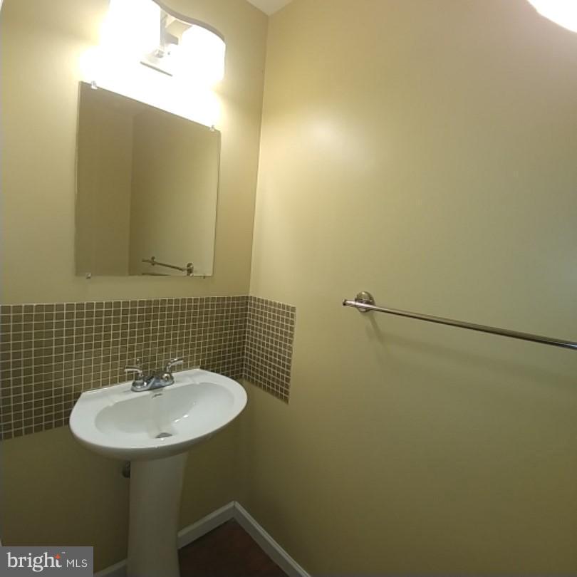 418 Haverhill Road Joppa, MD 21085 - Photo 13 of 28 a bathroom with a sink and a mirror