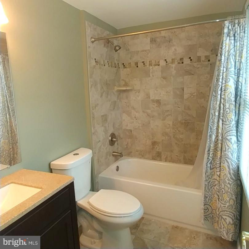 418 Haverhill Road Joppa, MD 21085 - Photo 17 of 28 a bathroom with a toilet and a bathtub