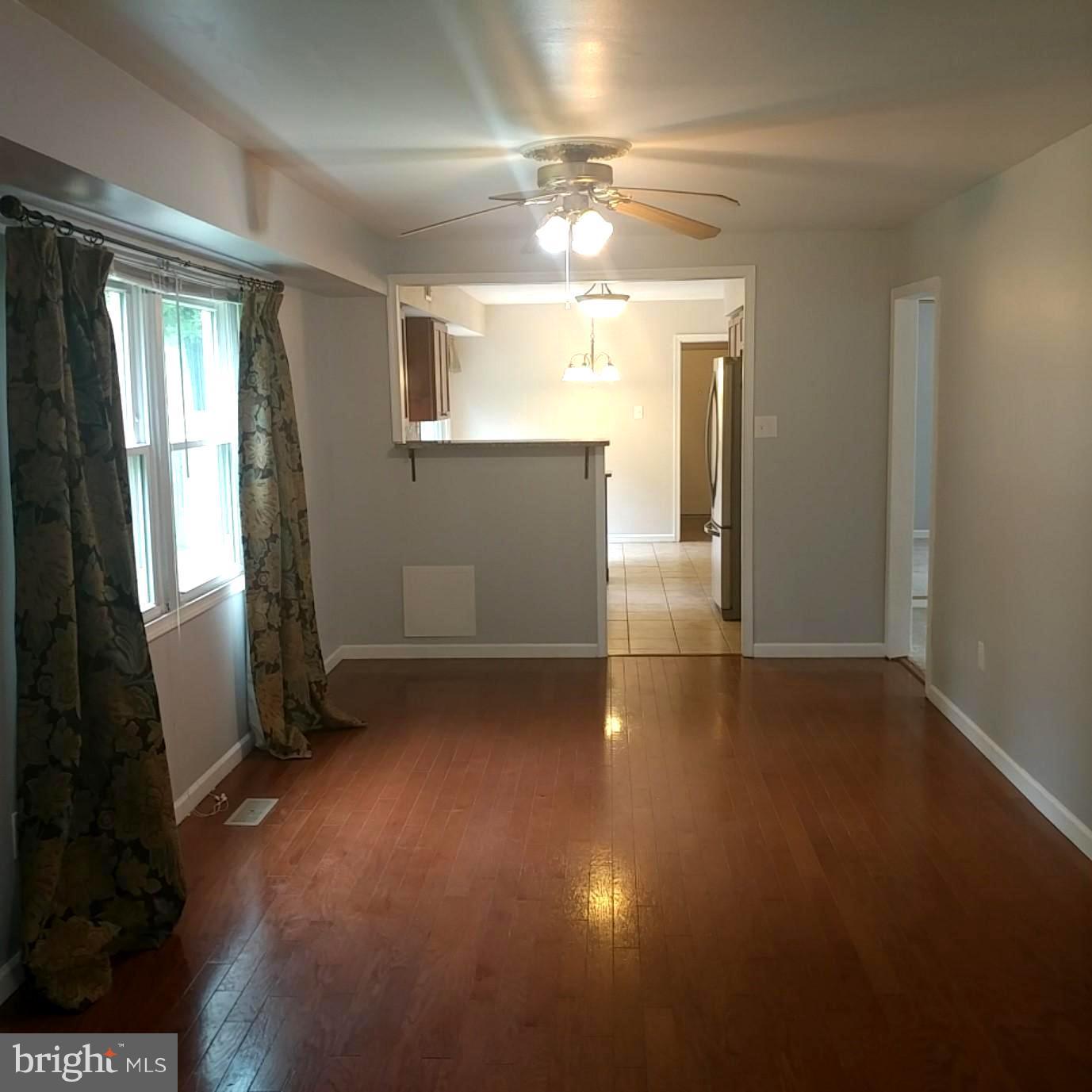 418 Haverhill Road Joppa, MD 21085 - Photo 8 of 28 en empty room with windows and fireplace