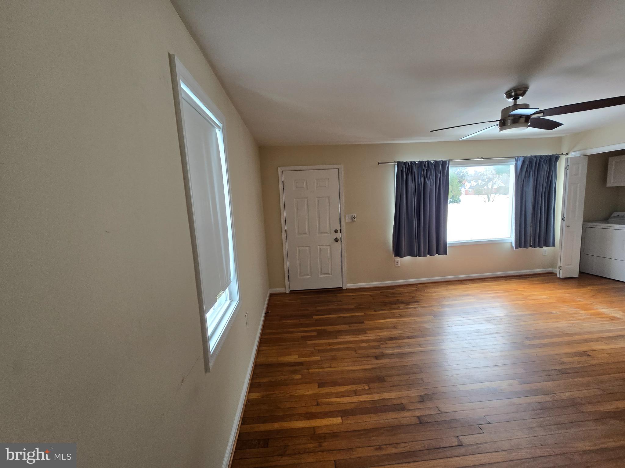 722 Church Hill Road Centreville, MD 21617 - Photo 4 of 7 wooden floor in an empty room with a window
