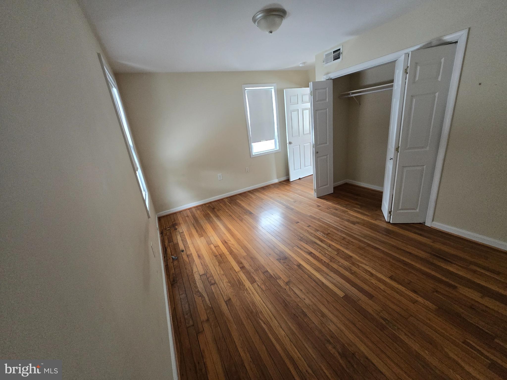 722 Church Hill Road Centreville, MD 21617 - Photo 5 of 7 wooden floor in an empty room with a window