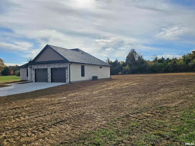 a backyard of a house with lots of green space