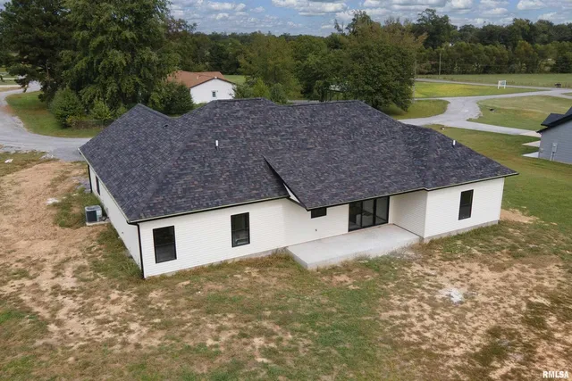 a view of a house with a yard and a tub