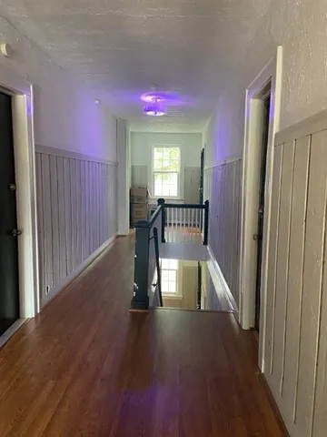 a view of entryway with wooden floor