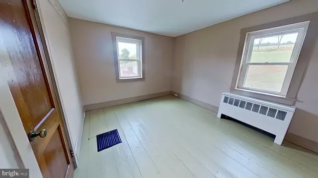 an empty room with windows