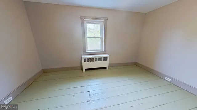 a view of a hallway with a window