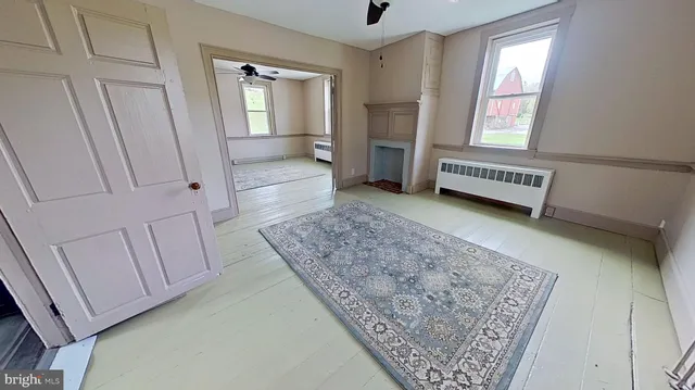 a view of hallway with window and stairs