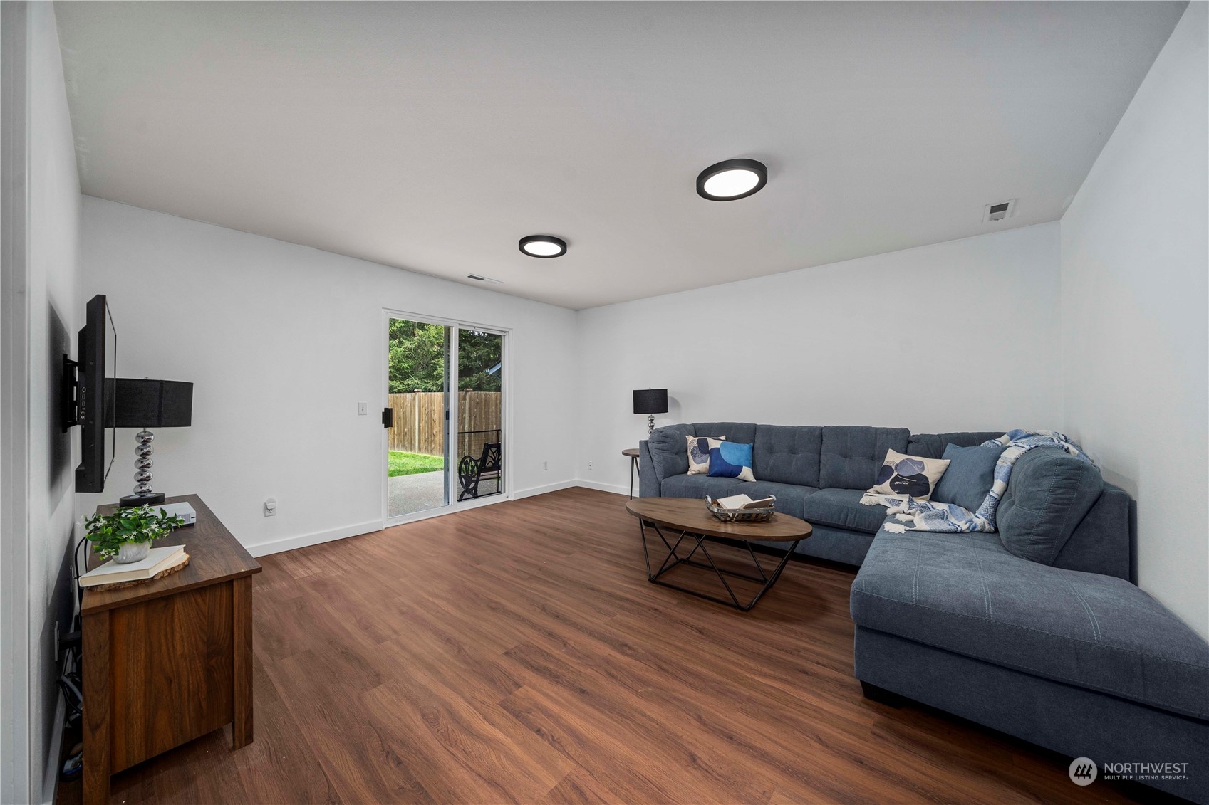 22716 Southeast 264th Place Maple Valley, WA 98038 - Photo 14 of 28 a living room with furniture and a wooden floor
