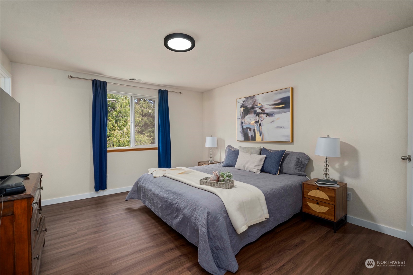 22716 Southeast 264th Place Maple Valley, WA 98038 - Photo 15 of 28 a bedroom with a bed and a window