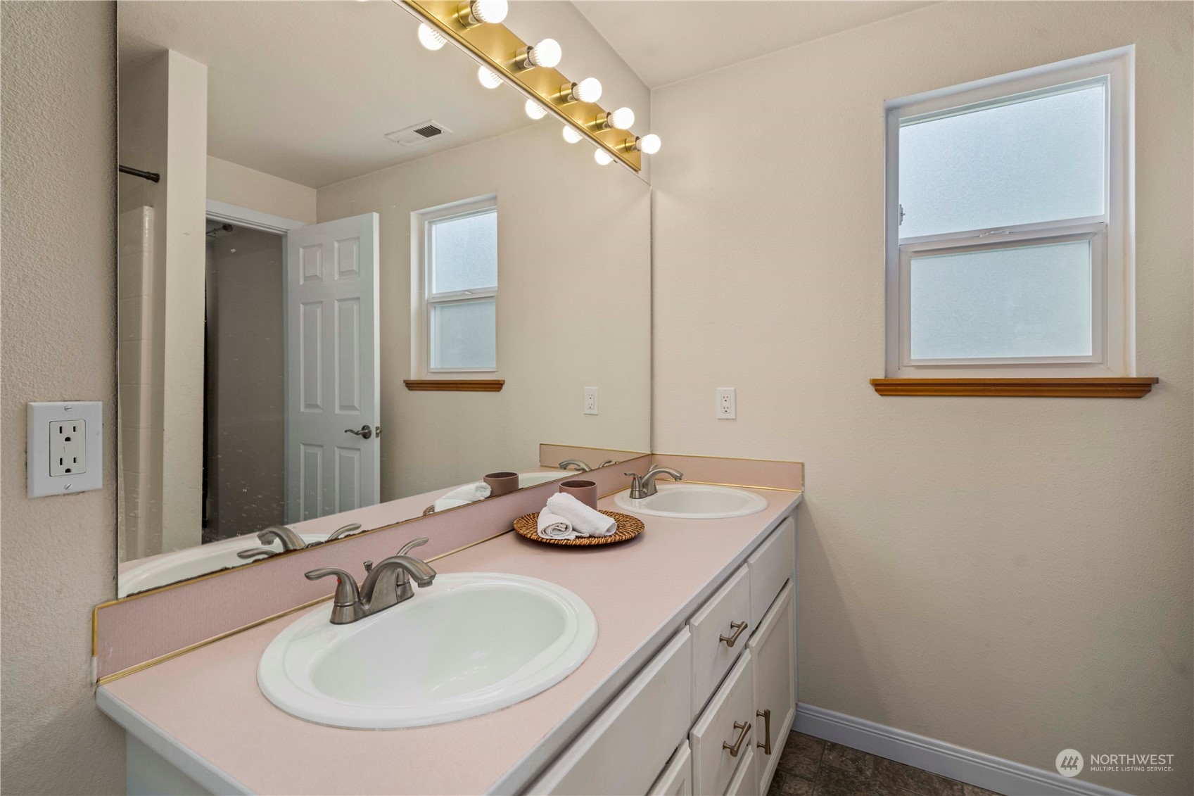22716 Southeast 264th Place Maple Valley, WA 98038 - Photo 16 of 28 a bathroom with a sink and a mirror