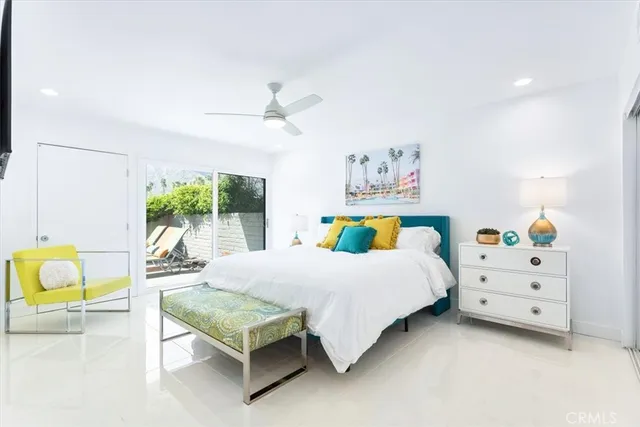 a bedroom with a bed and a couch