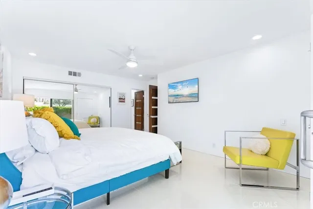 a bedroom with a bed and a couch