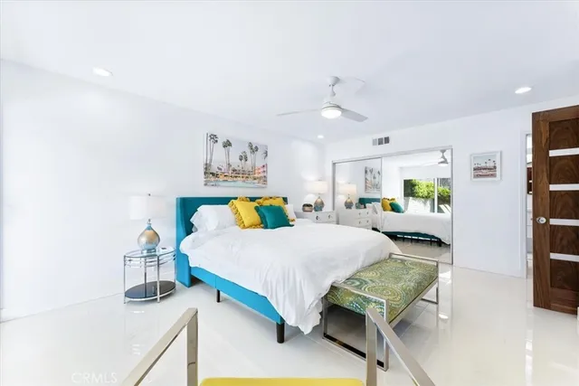 a bedroom with a bed and a cabinets