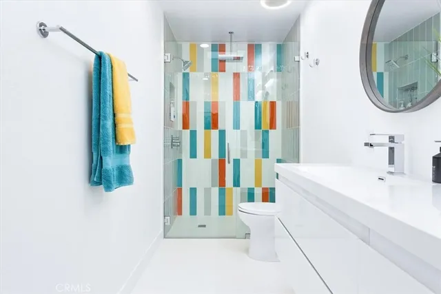 a bathroom with a tub sink and mirror