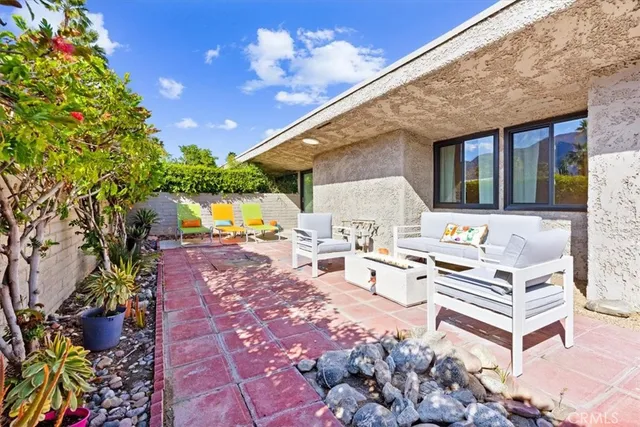 a view of a chairs and table in the patio