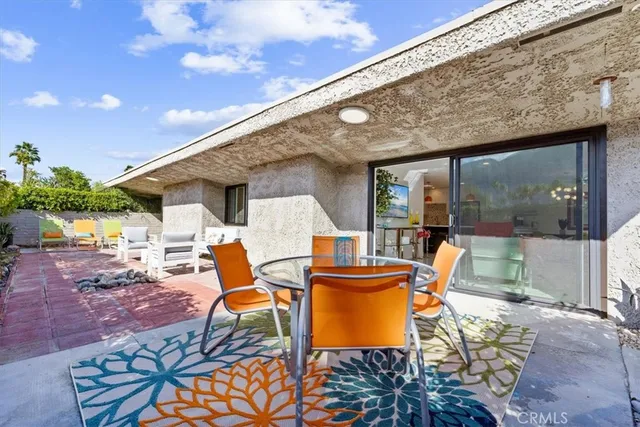 a backyard of a house with seating space