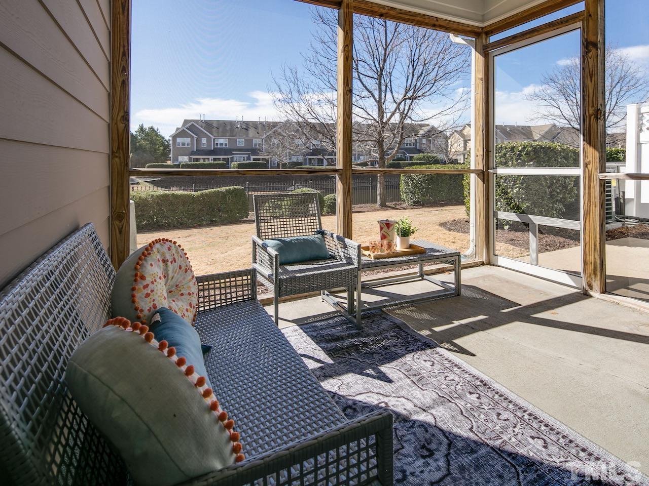 9133 Wooden Road Raleigh, NC 27617 - Photo 11 of 26 When the outside temperature is a bit warmer the screened porch becomes a great place to relax and read a book.