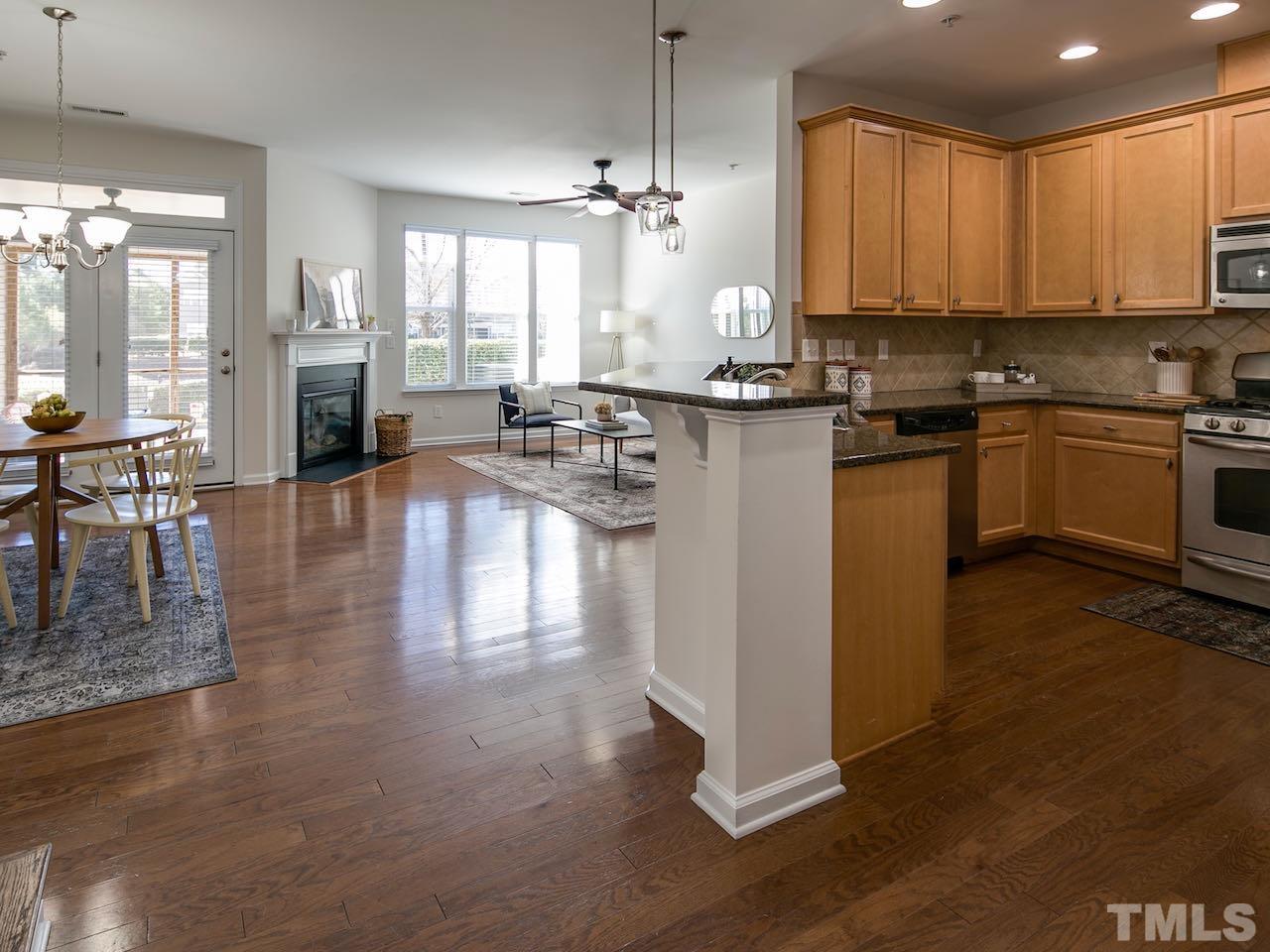 9133 Wooden Road Raleigh, NC 27617 - Photo 2 of 26 With a plethora of windows, 9133 Wooden Road gets lots of natural light. And there are nine-foot ceilings on both levels.