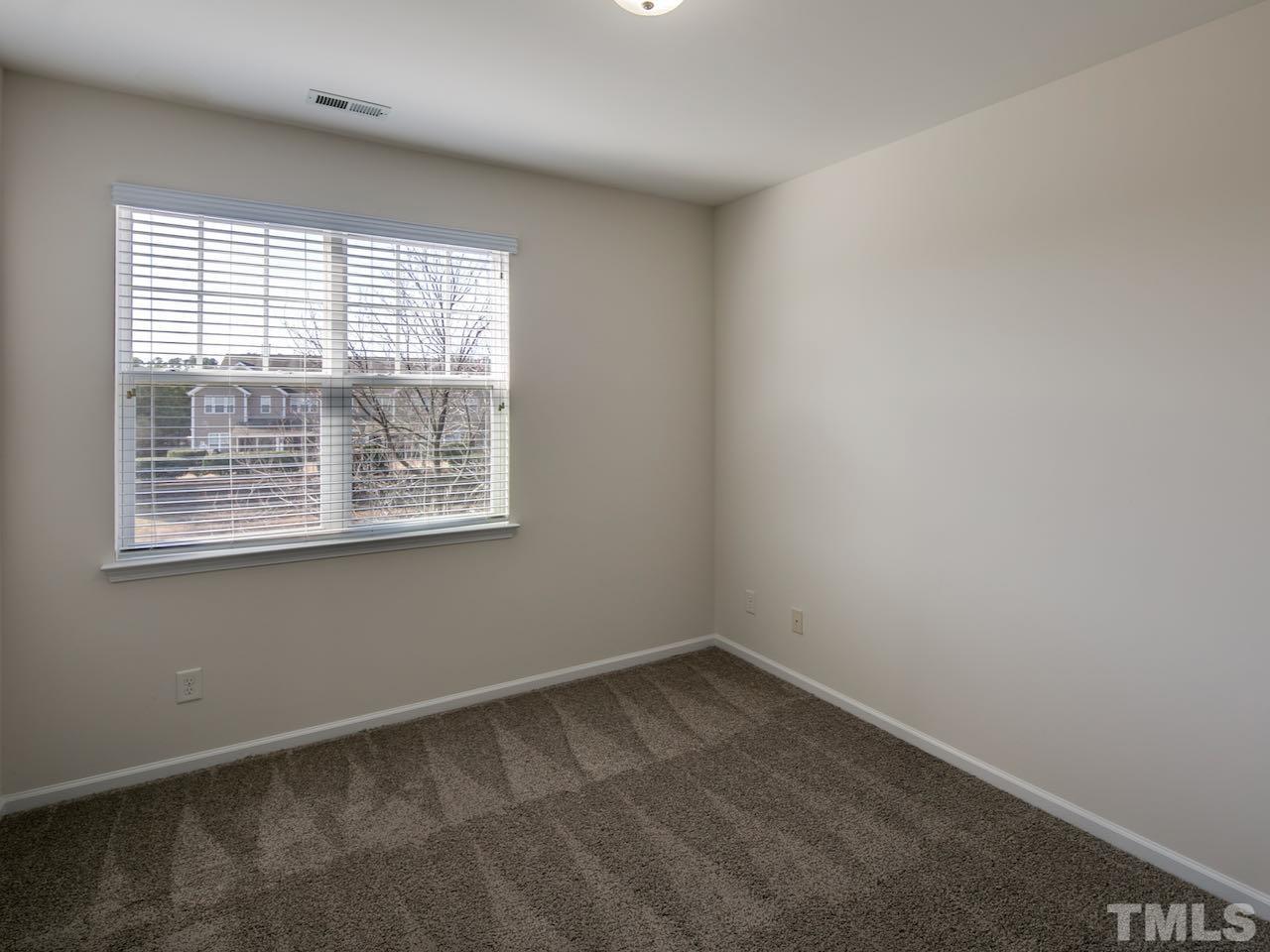 9133 Wooden Road Raleigh, NC 27617 - Photo 21 of 26 The second and third bedrooms have a nice view of the water.