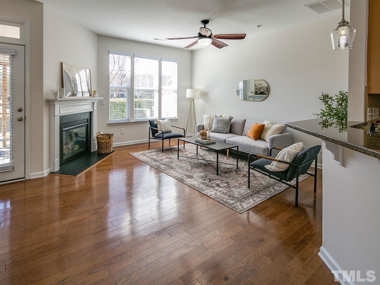 9133 Wooden Road Raleigh, NC 27617 - Photo 8 of 26 Throughout the main level is a beautiful manufactured hardwood floor. Quality construction.