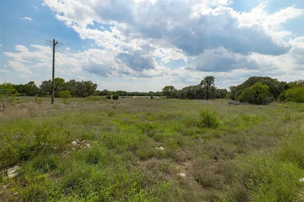 a view of a lake with a big yard