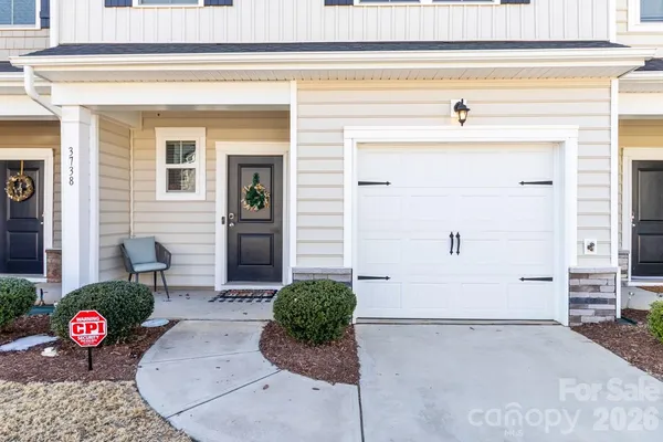 a front view of a house with a garage