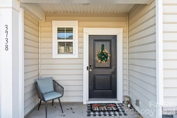 a view of a door and chair and door