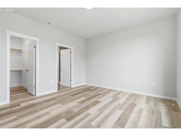 1758 Northeast 9th Street Hermiston, OR 97838 - Photo 13 of 23 a view of an empty room and wooden floor