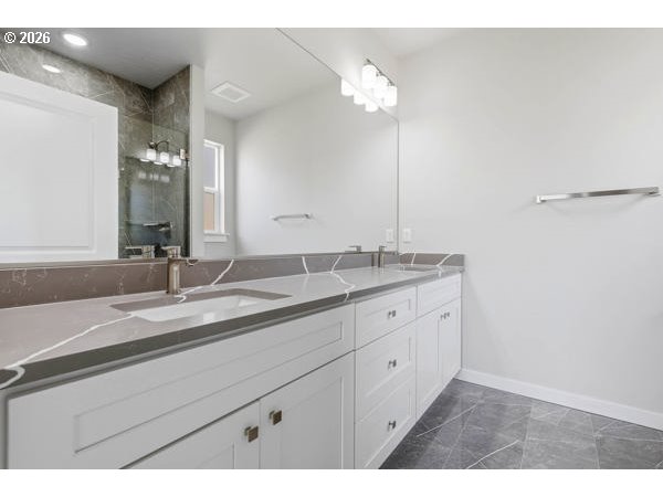 1758 Northeast 9th Street Hermiston, OR 97838 - Photo 16 of 23 a bathroom with a double vanity sink and a mirror